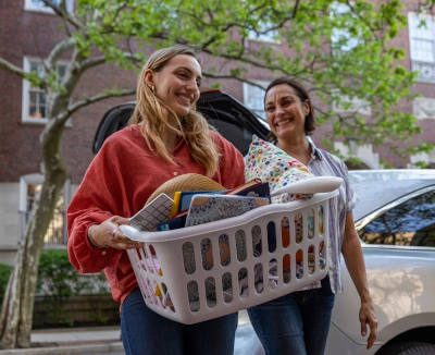 Mom and daughter smiling